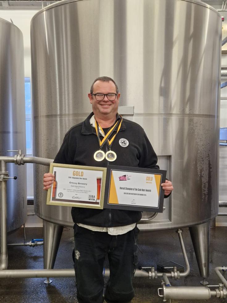 Andrew with awards